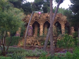 The rain returned but we plunged onwards visiting first Park Güell, named after entrepreneur, Eusebi Güell, who hired Antoni Gaudí, to design the park. In this photo, the columns look like tree trunks but are actually concrete to support a path above.