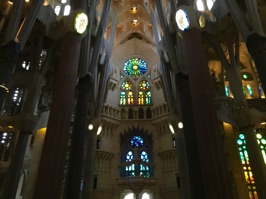 The windows on the lower part of the church are brightly colored while those above are lighter.  Some windows are clear to provide light to emphasize the vaulted ceilings.