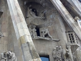 Further details from the Passion facade depicting Jesus being taken down from the cross. Gaudi devoted many of the last years of his life to the church construction and is buried at the Basilica.