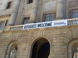 We saw signs like this in both Barcelona and Madrid. Spain has agreed to take in 15,000 Syrian refugees but many have not yet appeared.