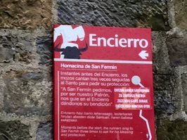Sign detailing the prayer to St. Fermin, repeated three times before the race begins.