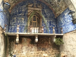 Azulejo gate entering Óbidos, Portugal. The earthenware tiles date from the Moors.  The Moors, Romans and others occupied this area over the years until 1148 when the first king of Portugal conquered the city.