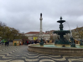 Rossio Square with farmers market stands in the little houses.