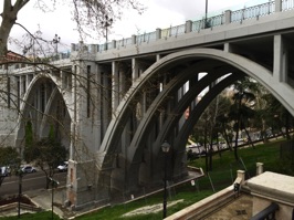 The Viaducto de Segovia.  Although hard to see from the photo, there is a plexiglass fence along the top of the original fence next to the pedestrian walkways.  Until the extra fencing was installed, this was a prime suicide site in Madrid.  In the 1990s. an average of four persons per month jumped the 80 feet from the top of the bridge.