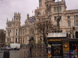 The Cybele Palace, formerly called the Palace of Communication.  It was once the headquarters of the postal service and became Madrid's City Hall in 2007. Note the Refugee sign on the building.