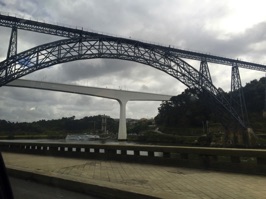 The Maria Pia Bridge, a railway bridge, built in 1877 by Gustave Eiffel. It carried trains across the Duoro River to Lisbon.  A modern bridge replaced it in 1991. The bridge was the longest single-arch span in the world when built.