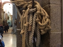 The ropes that are used to swing the huge Botafumeiro holding burning incense.  It takes six to eight men to swing the 180 pound container during Masses. See the video for a demonstration.